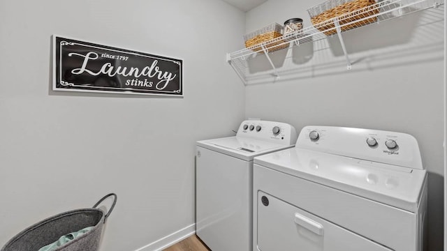 1415 Northview Dr, Waukee, IA 50263 - clothes washing area with independent washer and dryer, baseboards, and wood finished floors