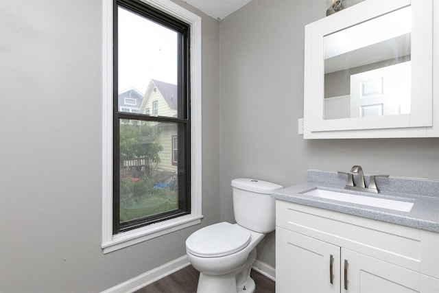 1360 E 9th St, Des Moines, IA 50316 - half bath featuring vanity and wood finished floors