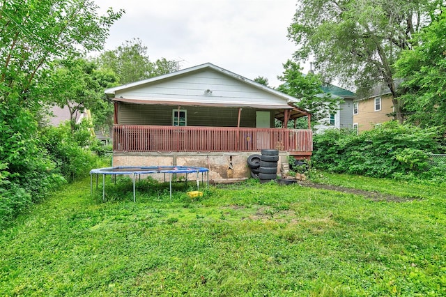 1360 E 9th St, Des Moines, IA 50316 - rear view of property with a trampoline and a yard