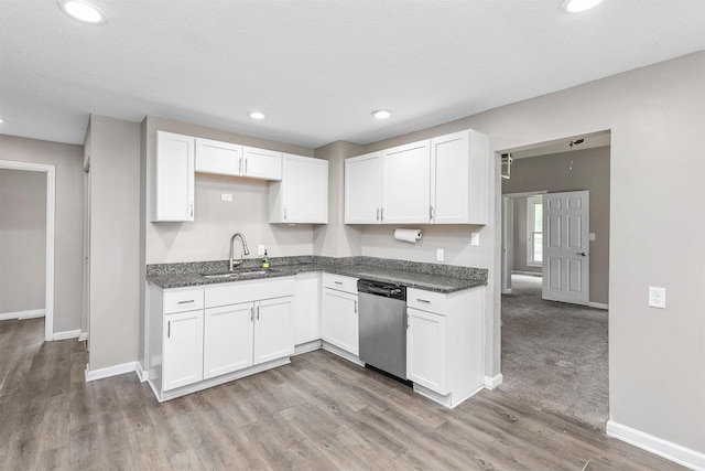 1360 E 9th St, Des Moines, IA 50316 - kitchen featuring dishwasher, white cabinets, light wood finished floors, and recessed lighting
