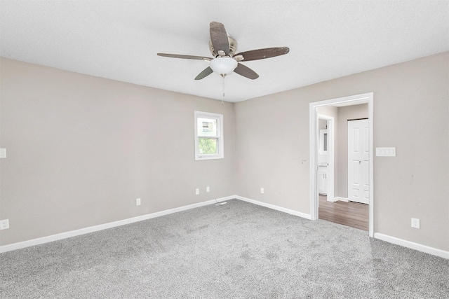 1360 E 9th St, Des Moines, IA 50316 - carpeted empty room featuring a ceiling fan and baseboards