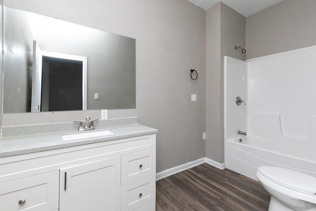 1360 E 9th St, Des Moines, IA 50316 - full bath with vanity, wood finished floors, and tub / shower combination
