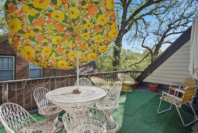 1534 41st St, Des Moines, IA 50311 - view of patio featuring outdoor dining area and a deck