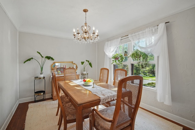 1534 41st St, Des Moines, IA 50311 - dining space featuring healthy amount of natural light, a chandelier, and baseboards