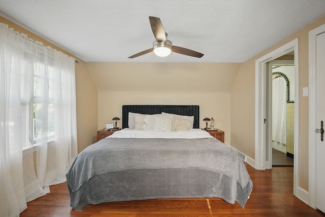 1534 41st St, Des Moines, IA 50311 - bedroom with vaulted ceiling, wood finished floors, ceiling fan, and baseboards
