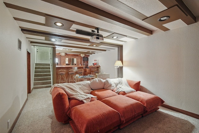 1534 41st St, Des Moines, IA 50311 - carpeted living room featuring bar with sink, baseboards, stairs, a textured wall, and recessed lighting