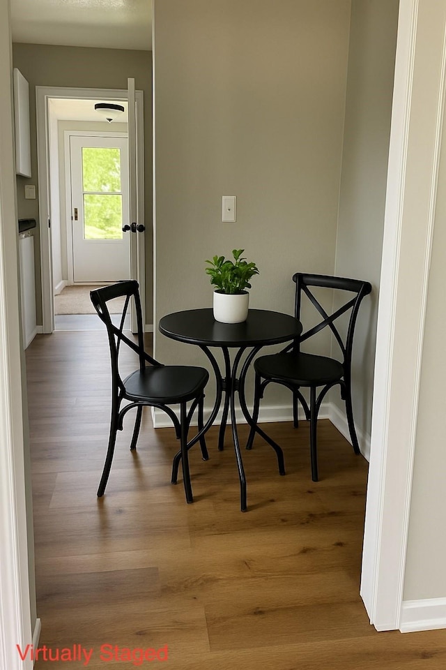 408 E Benton St, Winterset, IA 50273 - dining area with light wood-style flooring