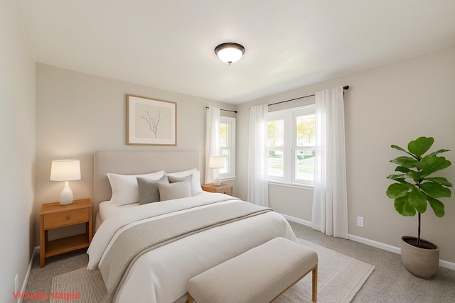 408 E Benton St, Winterset, IA 50273 - carpeted bedroom featuring baseboards