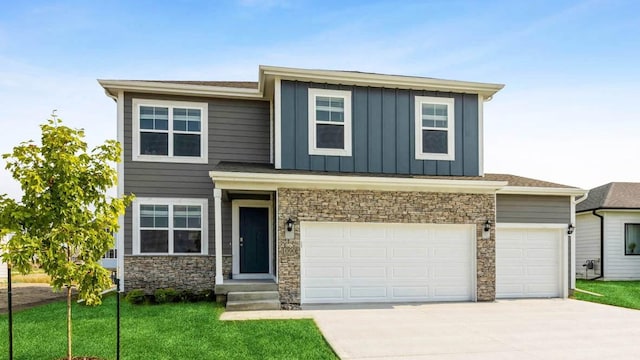 2809 Brook View Dr, Des Moines, IA 50317 - view of front facade featuring driveway, stone siding, board and batten siding, a front yard, and a garage