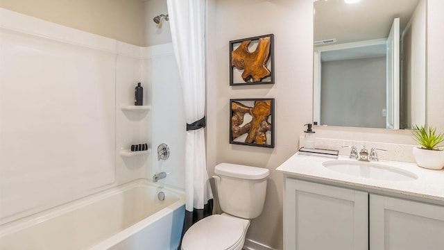 bathroom featuring toilet, shower / bath combo, and vanity