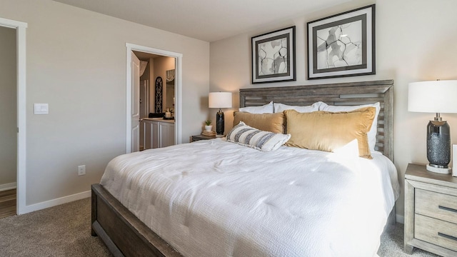 bedroom featuring carpet flooring, baseboards, and connected bathroom