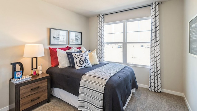 carpeted bedroom with baseboards