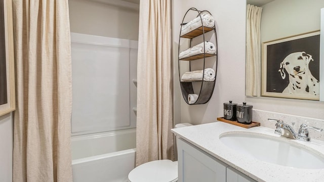 full bath featuring toilet, shower / bathtub combination with curtain, and vanity