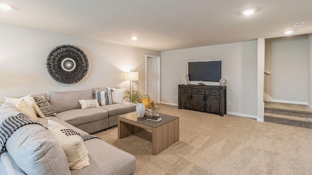 living room with light carpet, stairs, baseboards, and recessed lighting