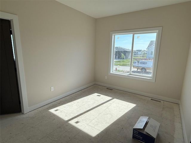empty room with baseboards