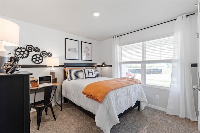 bedroom featuring carpet floors and baseboards