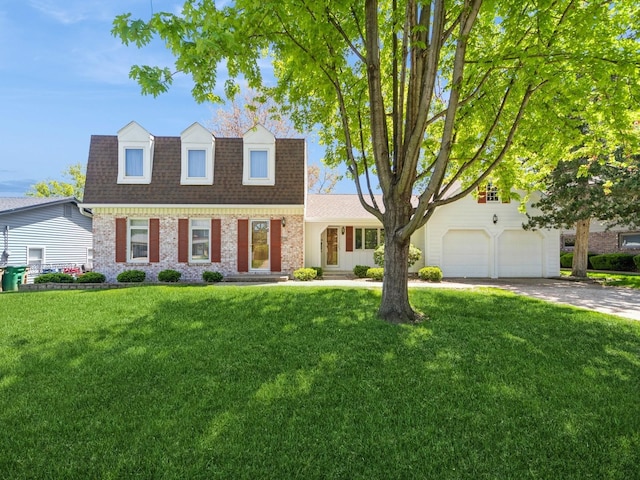 view of front of home featuring a shingled roof, brick siding, concrete driveway, a front yard, and a garage