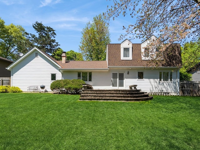 rear view of property featuring roof with shingles