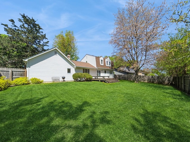 view of yard with a wooden deck