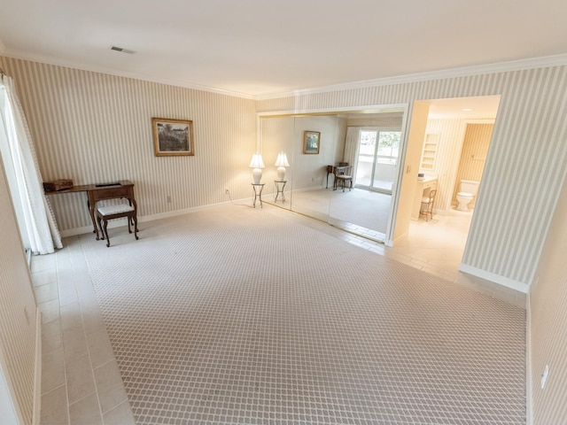 living area featuring crown molding, baseboards, and wallpapered walls