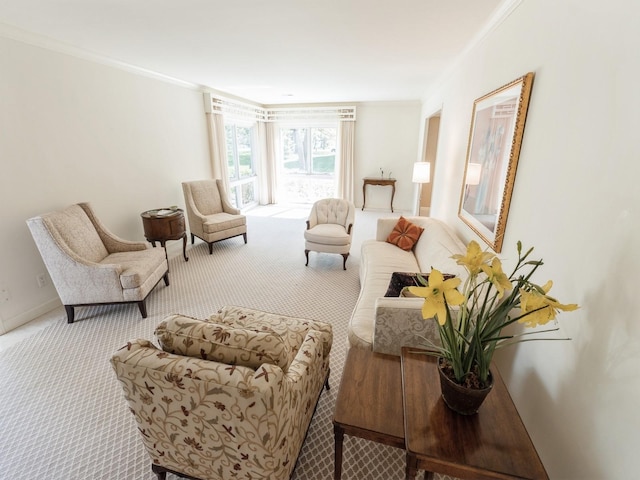 sitting room featuring carpet floors, crown molding, and baseboards