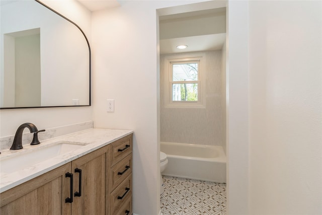 bathroom featuring toilet and vanity