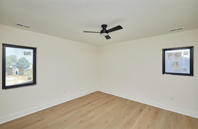 4727 Hillsdale Dr, Urbandale, IA 50322 - unfurnished room featuring light wood finished floors, baseboards, and a ceiling fan