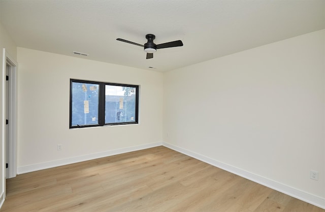 4727 Hillsdale Dr, Urbandale, IA 50322 - spare room with light wood-style floors, ceiling fan, and baseboards