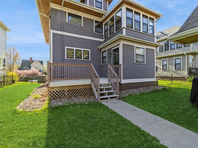 back of house featuring a deck and central AC