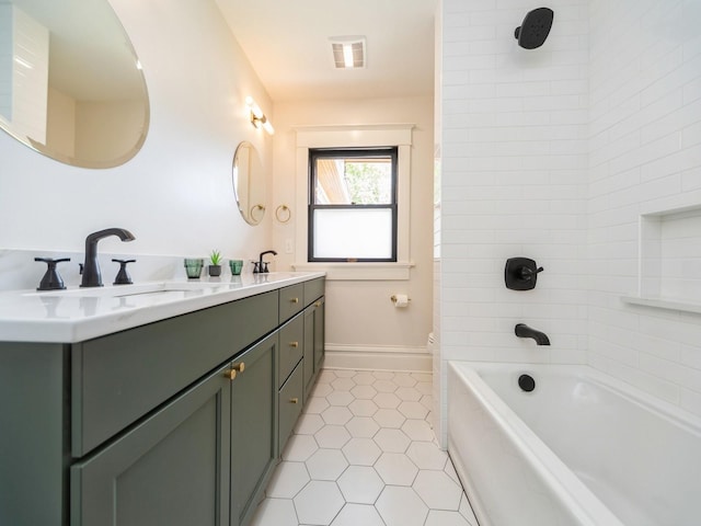 bathroom featuring toilet, tile patterned flooring, double vanity, and tub / shower combination