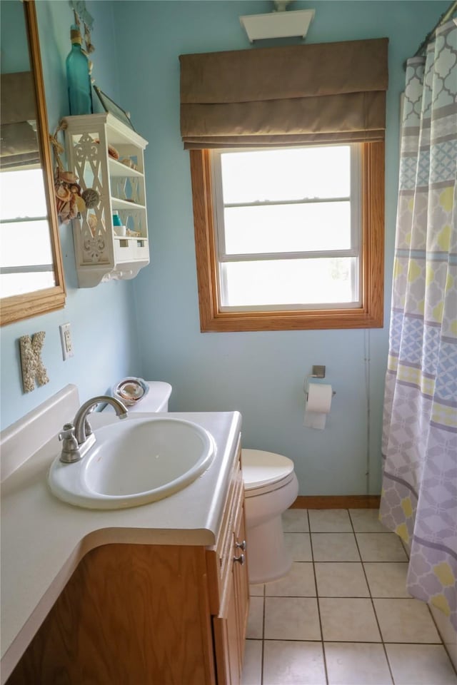 bathroom featuring vanity, toilet, tile patterned flooring, and a shower with shower curtain