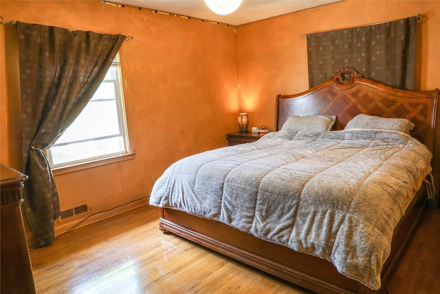 bedroom featuring wood finished floors