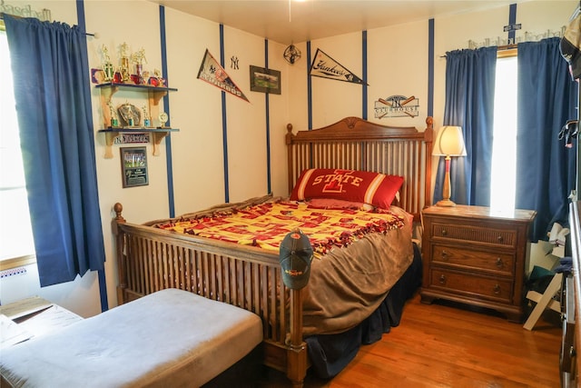 bedroom with wood finished floors