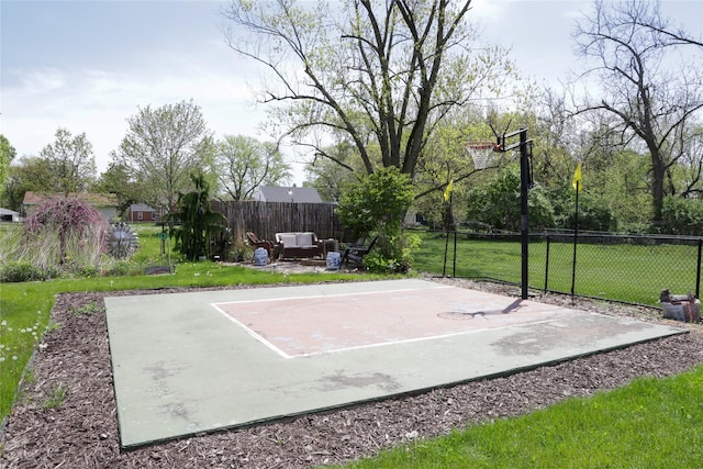 view of sport court with basketball hoop