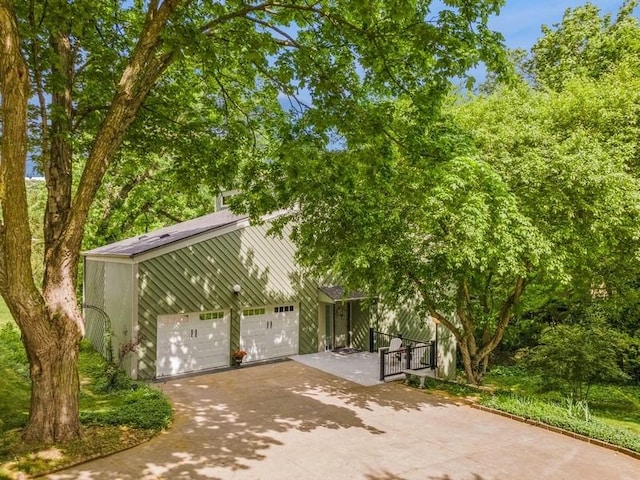 3919 Burr Oak Ln, Ames, IA 50014 - view of front of home with concrete driveway and a garage