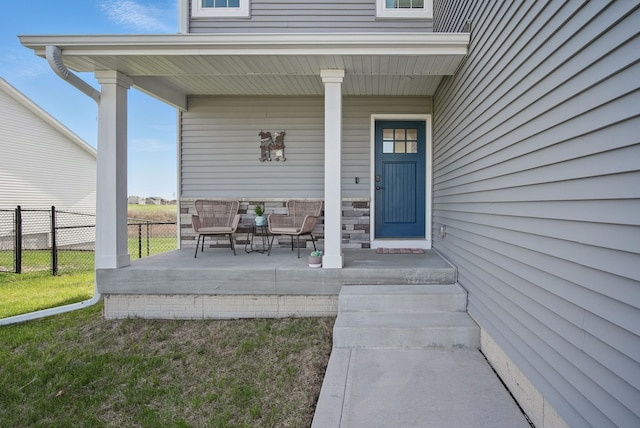 property entrance featuring covered porch