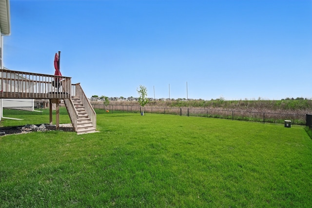 view of yard with stairs and a wooden deck