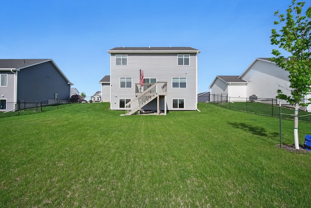back of house featuring stairway and a wooden deck