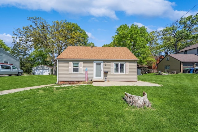 1523 Allison Ave, Des Moines, IA 50314 - view of front facade with a front yard, a patio area, and roof with shingles