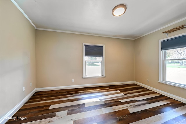 1523 Allison Ave, Des Moines, IA 50314 - spare room featuring ornamental molding, healthy amount of natural light, wood finished floors, and baseboards