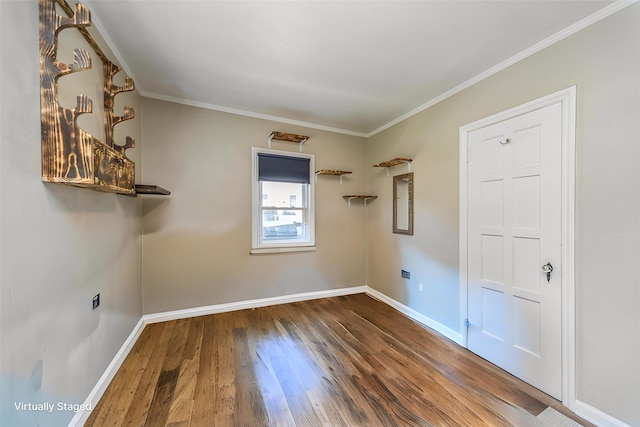 1523 Allison Ave, Des Moines, IA 50314 - unfurnished room featuring baseboards, wood finished floors, and ornamental molding