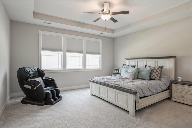 2920 Oak St, Norwalk, IA 50211 - bedroom featuring light colored carpet, baseboards, a tray ceiling, and a ceiling fan