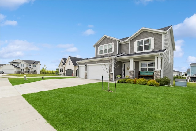 2920 Oak St, Norwalk, IA 50211 - view of front of house with driveway, a front yard, covered porch, and a garage
