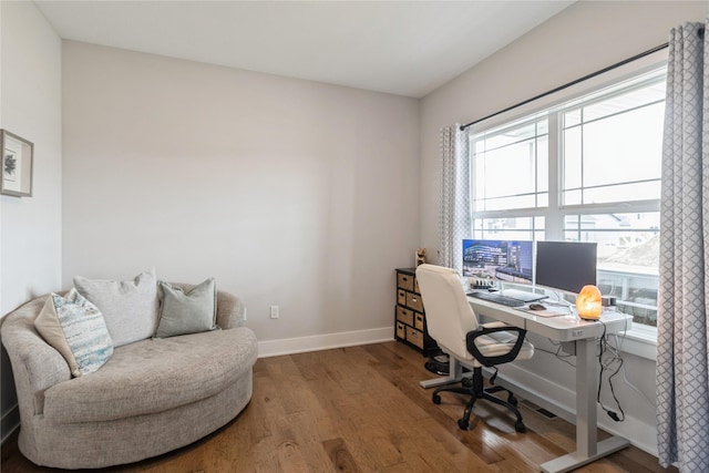 2920 Oak St, Norwalk, IA 50211 - home office featuring healthy amount of natural light, wood finished floors, and baseboards
