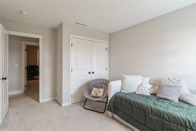 2920 Oak St, Norwalk, IA 50211 - bedroom featuring light colored carpet, a closet, and baseboards