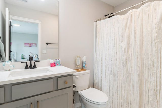 2920 Oak St, Norwalk, IA 50211 - full bath with vanity, toilet, and a shower with shower curtain