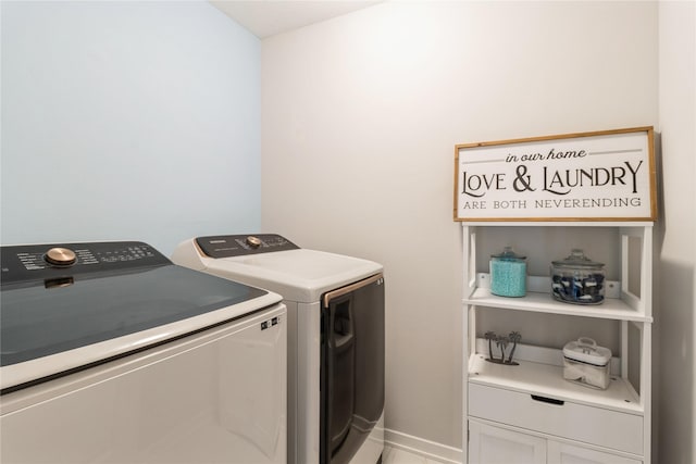 2920 Oak St, Norwalk, IA 50211 - laundry area featuring washer and dryer, cabinet space, and baseboards