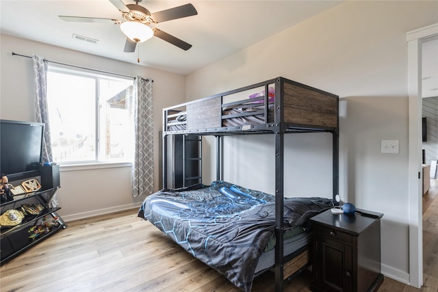 2920 Oak St, Norwalk, IA 50211 - bedroom with wood finished floors, baseboards, and a ceiling fan