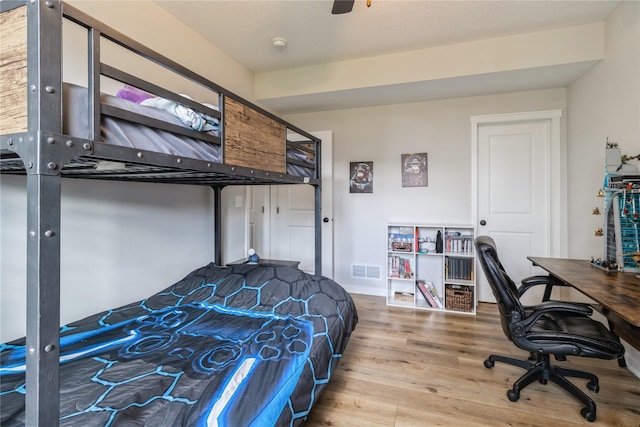 2920 Oak St, Norwalk, IA 50211 - bedroom with wood finished floors, ceiling fan, and an office area