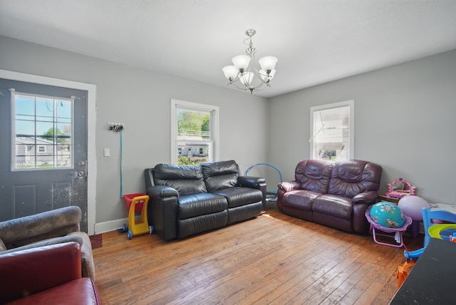 2057 Maple St, Des Moines, IA 50317 - living area with a chandelier, hardwood / wood-style floors, and baseboards